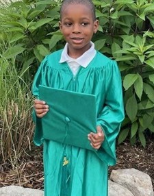young boy in cap and gown